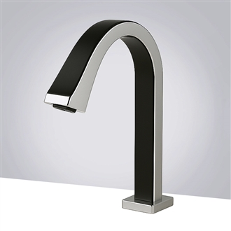 Modern commercial restroom with touchless sink fixtures