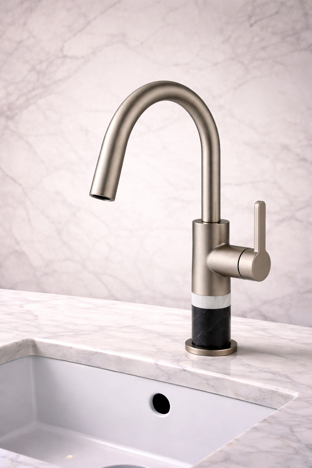 Close-up of brushed nickel vanity faucet in a bright bathroom with modern sink and countertop